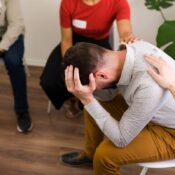 man in peer support group for addiction