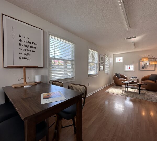 table and chairs with poster in background at Jacksonville addiction treatment center